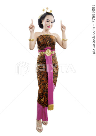 Asian woman with Java traditional dance costume showing something Asian woman with Java traditional dance costume showing something 77699893