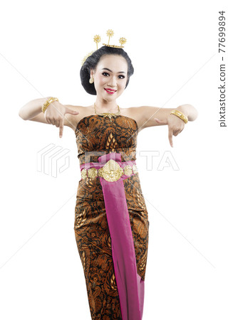 Asian woman with Java traditional dance costume showing something Asian woman with Java traditional dance costume showing something 77699894