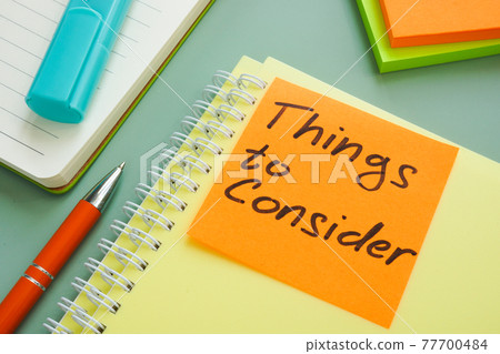 Things to consider memo on the stack of documents. Things to consider memo on the stack of documents. 77700484