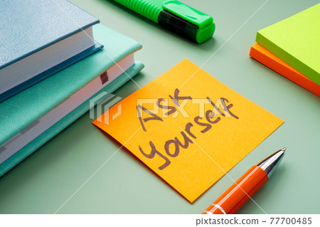 Motivational sign Ask yourself on the workplace. Motivational sign Ask yourself on the workplace. 77700485