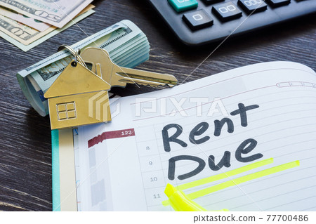 Rent due sign in the planner and key. 77700486