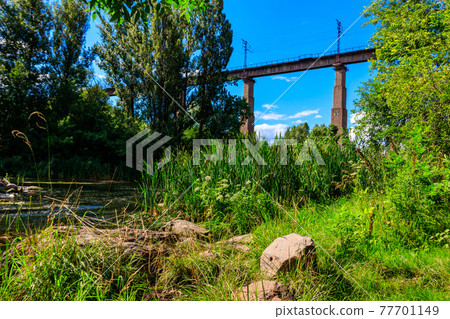 Railway Bridge viaduct across the Inhulets river in Kryvyi Rih, Ukraine 77701149