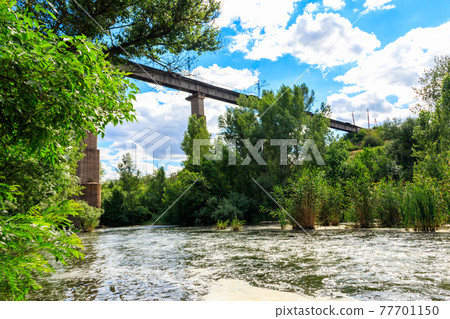 Railway Bridge viaduct across the Inhulets river in Kryvyi Rih, Ukraine 77701150