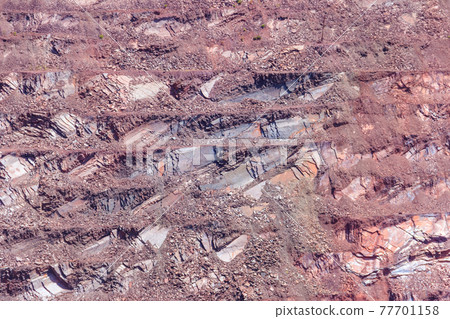 Close-up of red mining levels at iron ore quarry. Open-cast mine, open pit. Background, texture 77701158