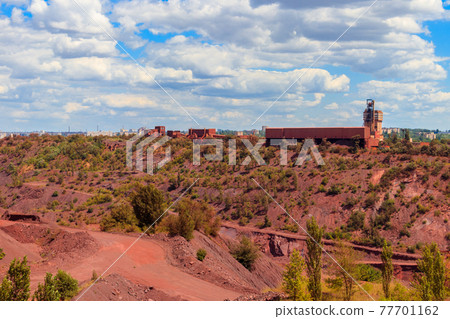 View of huge iron ore quarry in Kryvyi Rih, Ukraine. Open pit mining View of huge iron ore quarry in Kryvyi Rih, Ukraine. Open pit mining 77701162