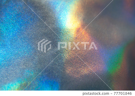 Holographic rainbow iridescent wrinkled background. Abstract and blurred backdrop Holographic rainbow iridescent wrinkled background. Abstract and blurred backdrop 77701846