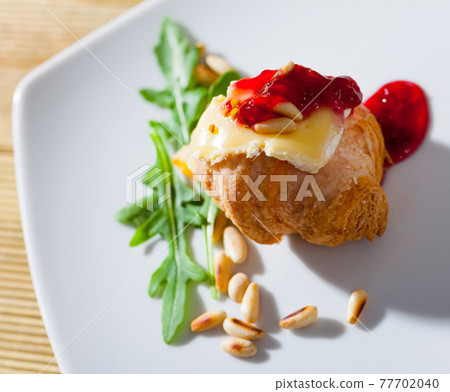Camembert on top of mini croissant Camembert on top of mini croissant 77702040
