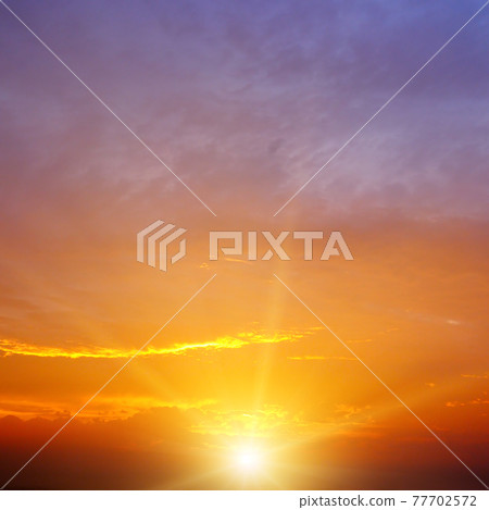 Scenic orange sunset sky background Scenic orange sunset sky background 77702572