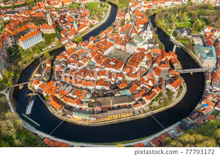 Panoramic view from above of amazing touristic old town Cesky Krumlov and river Vltava, Czech Republic Panoramic view from above of amazing touristic old town Cesky Krumlov and river Vltava, Czech Republic 77703172