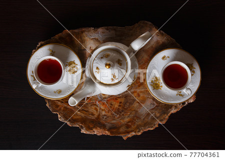 Elegant coffee set on an exclusive tray 77704361