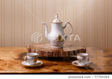 Elegant coffee set on an exclusive tray Elegant coffee set on an exclusive tray 77704364