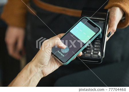 Using smartphone while paying by NFC 77704468