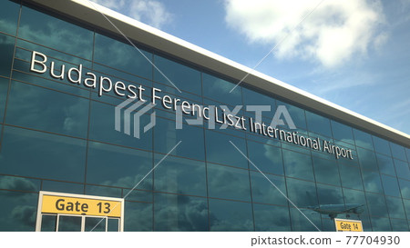 Landing airplane reflects in the modern windows with Budapest Ferenc Liszt International Airport text. 3d rendering Landing airplane reflects in the modern windows with Budapest Ferenc Liszt International Airport text. 3d rendering 77704930