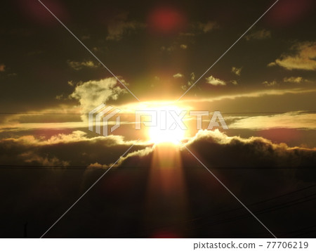 Sunset in the clouds 77706219