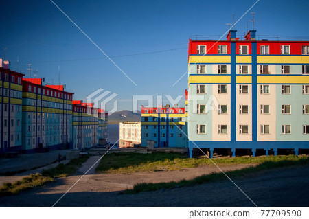 Colorful buildings on the streets of the city in the Far North. Anadyr, Chukotka, Russia. Colorful buildings on the streets of the city in the Far North. Anadyr, Chukotka, Russia. 77709590