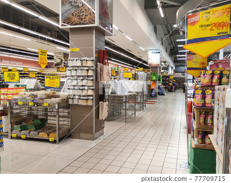 SEREMBAN, MALAYSIA -MARCH 2, 2021: Interior of a hypermarket. Daily necessities and groceries are displayed on sales shelves and price tagged. Sorted by type and brand. 77709715