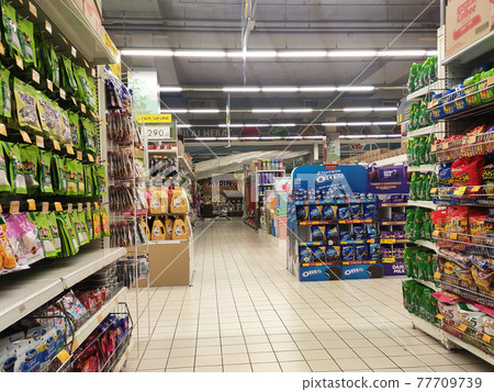 SEREMBAN, MALAYSIA -MARCH 2, 2021: Interior of a hypermarket. Daily necessities and groceries are displayed on sales shelves and price tagged. Sorted by type and brand. 77709739