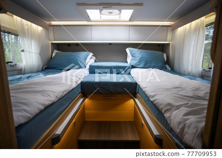 Greasy places, beds in a camper. Beds in a mobile home. Bedroom interior in a mobile home. 77709953