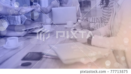 Composition of light circles over group of businesspeople Composition of light circles over group of businesspeople 77713875