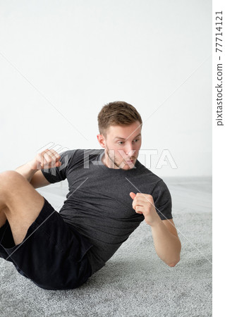 athletic man home training abs fitness workout 77714121