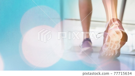 Composition of spots of light over woman running on treadmill with foot bones showing 77715634