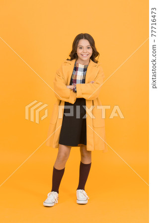 Get cozy in style this autumn season. Happy small girl wear comfortable fashion style. Get cozy in style this autumn season. Happy small girl wear comfortable fashion style. 77716473