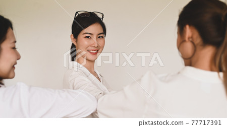 Women are greeting each other with the elbow. Elbow bumps greeting style to prevent contact and virus spread. Women are greeting each other with the elbow. Elbow bumps greeting style to prevent contact and virus spread. 77717391