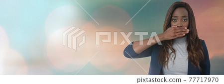 Black woman putting her hand in front of her mouth against ligh concept background 77717970