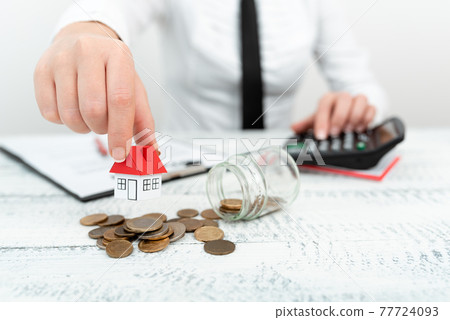 Lady Presenting New Home Savings Deals In Outfit, Business Woman Showing Possible Investment Oppurtiunities For New House, Mortegage Installments Exhibits For Recent Apartments Sales 77724093
