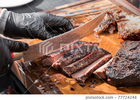 Chef Slicing Roast Beef Using Carving Knife Stock Photo - Download