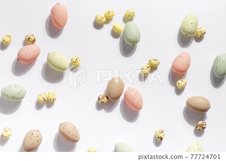 Happy Easter holiday background with colorful pastel eggs on white paper . 77724701