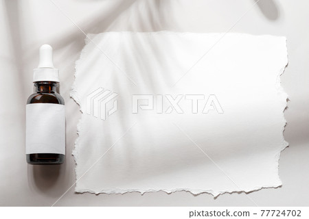 Pipette mockup cosmetic brown bottle with paper on grey shadows background 77724702
