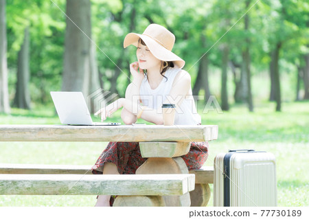 A young woman worcation in the fresh green A young woman worcation in the fresh green 77730189