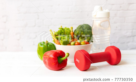 Close up dumbbell. Diet Health food and lifestyle health concept. Close up dumbbell. Diet Health food and lifestyle health concept. 77730350