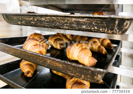 Fresh croissants 77730359