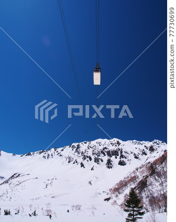 View of Tateyama Ropeway from Tanbodaira, Tateyama Kurobe Alpine Route with remaining snow 77730699