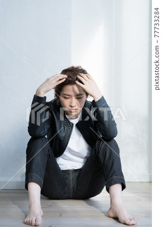 Genderless LGBT woman wearing a leather jacket 77733284