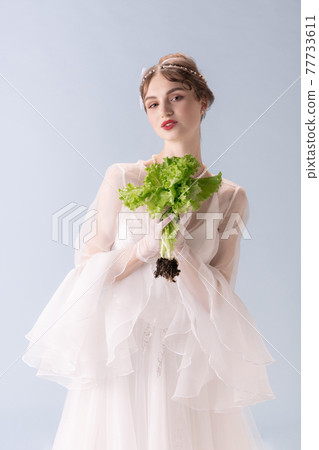 Young woman in art action isolated on white background. Retro style, comparison of eras concept. Young woman in art action isolated on white background. Retro style, comparison of eras concept. 77733611