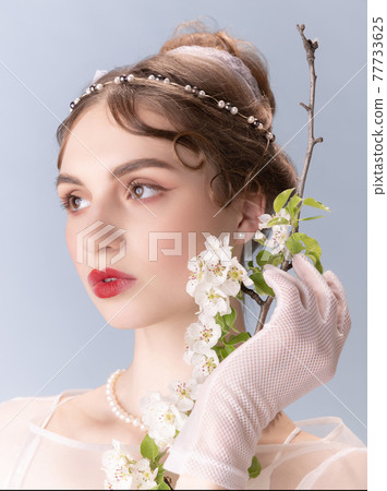 Young woman in art action isolated on white background. Retro style, comparison of eras concept. 77733625