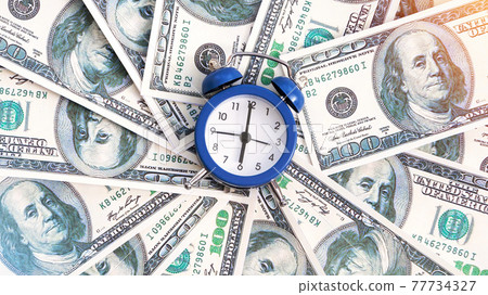 A layer of money with clock in the center A layer of money with clock in the center 77734327