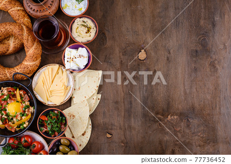 Traditional Turkish breakfast with meze and simit Traditional Turkish breakfast with meze and simit 77736452