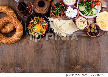 Traditional Turkish breakfast with meze and simit Traditional Turkish breakfast with meze and simit 77736453