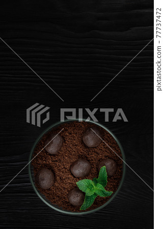 Chocolate dessert of cookies with pieces of chocolate 77737472