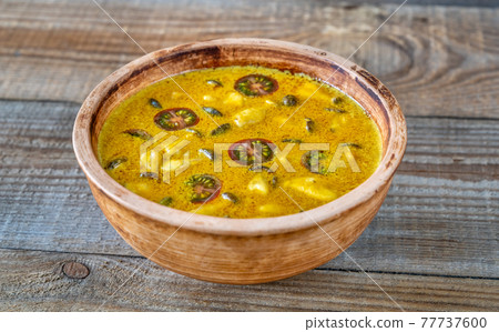 Bowl of yellow curry 77737600