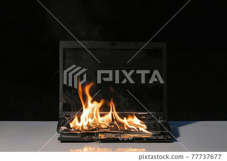 Burning laptop computer Burning laptop computer 77737677