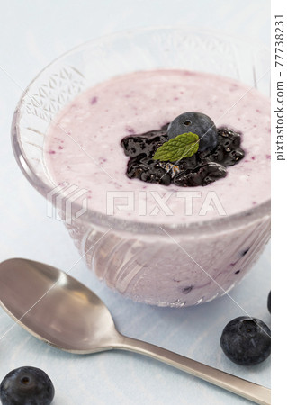Blueberry yogurt in a glass container Blueberry yogurt in a glass container 77738231