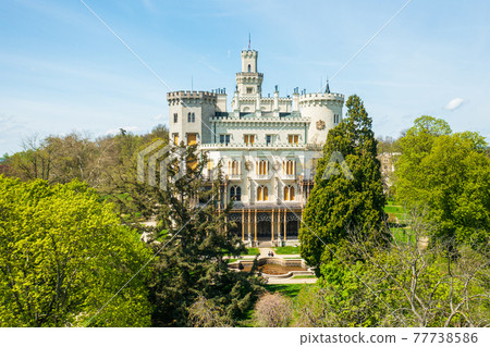 Aerial view on the castle in Hluboka nad Vltavou, historic chateau with beautiful gardens near Ceske Budejovice, Czech Republic Aerial view on the castle in Hluboka nad Vltavou, historic chateau with beautiful gardens near Ceske Budejovice, Czech Republic 77738586