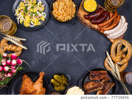 Oktoberfest dishes with beer, pretzel and sausage Oktoberfest dishes with beer, pretzel and sausage 77739856