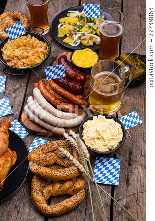 Oktoberfest dishes with beer, pretzel and sausage Oktoberfest dishes with beer, pretzel and sausage 77739863