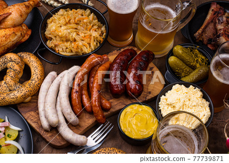 Oktoberfest dishes with beer, pretzel and sausage Oktoberfest dishes with beer, pretzel and sausage 77739871